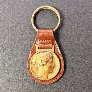 Keychain - possibly a  bust of a Greek goddess like Athena